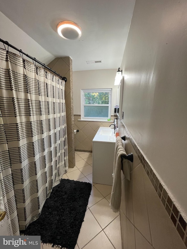 7301 Granite Rd, Elkins Park, PA 19027 - bathroom featuring tile walls, vanity, tile patterned flooring, a wainscoted wall, and curtained shower