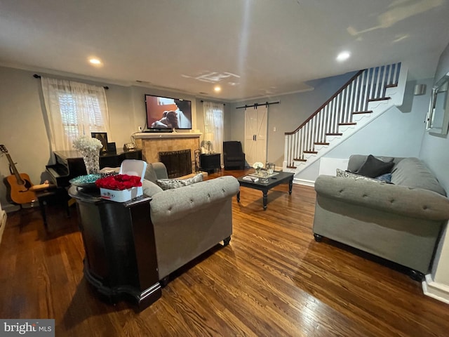 7301 Granite Rd, Elkins Park, PA 19027 - living area featuring stairway, dark wood-type flooring, a barn door, recessed lighting, and a fireplace