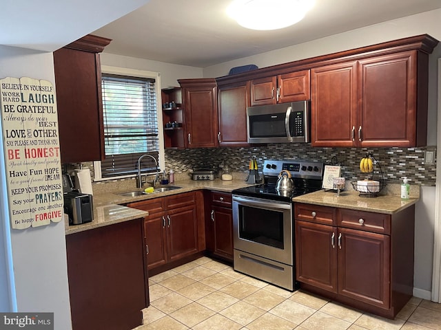 7301 Granite Rd, Elkins Park, PA 19027 - kitchen featuring stainless steel appliances, backsplash, light tile patterned floors, and light stone countertops