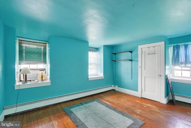 2605 N Sherman St, York, PA 17406 - unfurnished room featuring a baseboard heating unit, wood-type flooring, and cooling unit