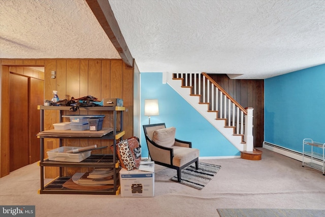 2605 N Sherman St, York, PA 17406 - living area with a textured ceiling, carpet floors, stairway, wood walls, and beam ceiling