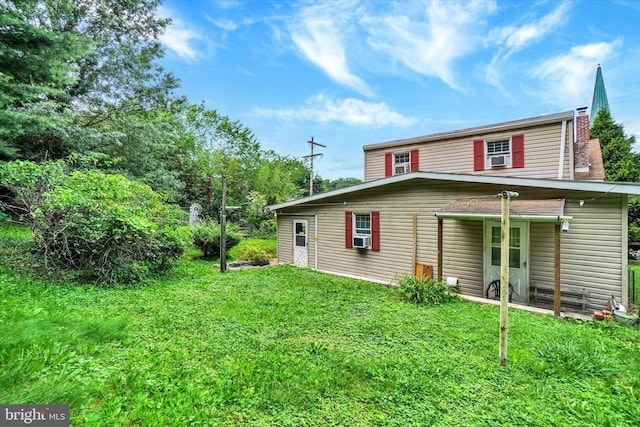 2605 N Sherman St, York, PA 17406 - back of property with a lawn and cooling unit
