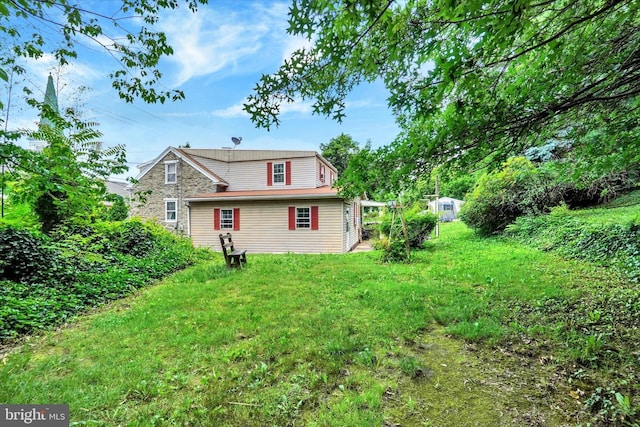 2605 N Sherman St, York, PA 17406 - view of home's exterior with a storage unit and a lawn
