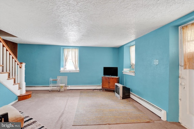 2605 N Sherman St, York, PA 17406 - unfurnished living room with a baseboard radiator, carpet floors, stairway, and a textured ceiling