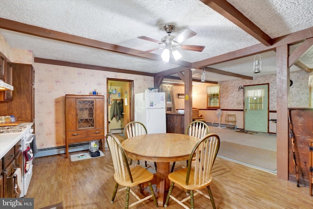 2605 N Sherman St, York, PA 17406 - dining space with wallpapered walls, a textured ceiling, light wood-type flooring, ceiling fan, and baseboard heating