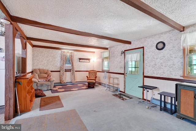 2605 N Sherman St, York, PA 17406 - interior space featuring a textured ceiling, beam ceiling, wallpapered walls, and a wainscoted wall