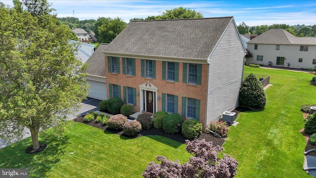 32 Duffield Dr, Lititz, PA 17543 - colonial-style house with an attached garage, a front lawn, and a shingled roof