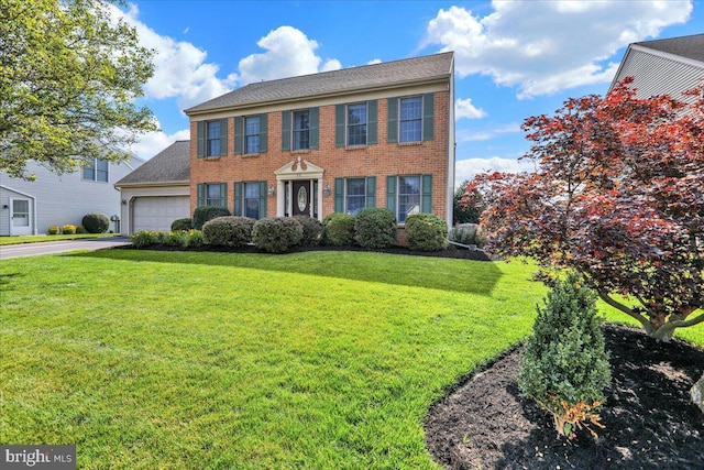 32 Duffield Dr, Lititz, PA 17543 - colonial house with brick siding, a garage, a front yard, and concrete driveway