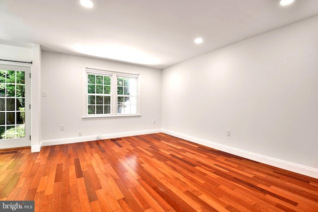 7809 Heatherton Ln, Potomac, MD 20854 - empty room with hardwood / wood-style floors, healthy amount of natural light, and recessed lighting