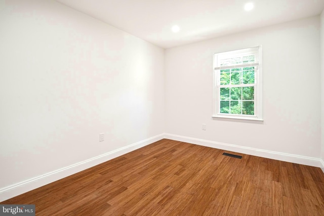 7809 Heatherton Ln, Potomac, MD 20854 - empty room featuring wood finished floors and recessed lighting