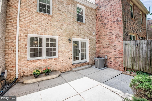 7809 Heatherton Ln, Potomac, MD 20854 - rear view of property with a patio area, brick siding, and french doors