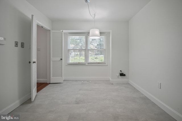 7809 Heatherton Ln, Potomac, MD 20854 - unfurnished dining area featuring baseboards