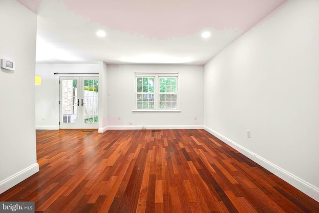 7809 Heatherton Ln, Potomac, MD 20854 - spare room with french doors, wood finished floors, and recessed lighting