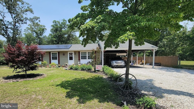 796 Porchtown Rd, Franklinville, NJ 08322 - view of front of home with gravel driveway, solar panels, and a carport
