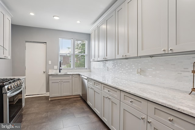7357 E Walnut Ln, Philadelphia, PA 19138 - kitchen featuring appliances with stainless steel finishes, tasteful backsplash, recessed lighting, and light stone countertops