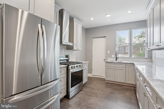 7357 E Walnut Ln, Philadelphia, PA 19138 - kitchen featuring stainless steel appliances, wall chimney range hood, decorative backsplash, recessed lighting, and light stone countertops