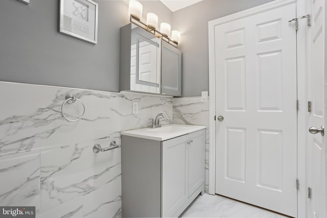 7357 E Walnut Ln, Philadelphia, PA 19138 - bathroom with marble look tiles, vanity, and tile walls