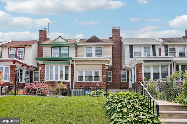 7357 E Walnut Ln, Philadelphia, PA 19138 - view of property featuring brick siding and a front lawn