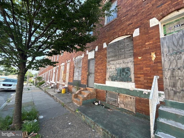22 Wheeler Ave, Baltimore, MD 21223 - view of side of property featuring entry steps and brick siding