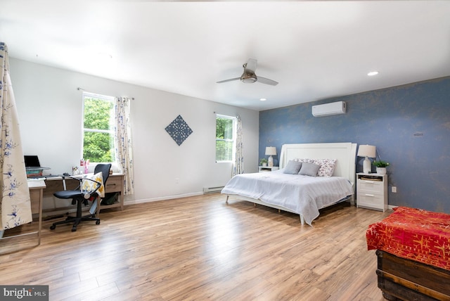 3789 Spring Rd, Carlisle, PA 17013 - bedroom featuring a wall mounted AC, multiple windows, an office area, wood finished floors, and recessed lighting