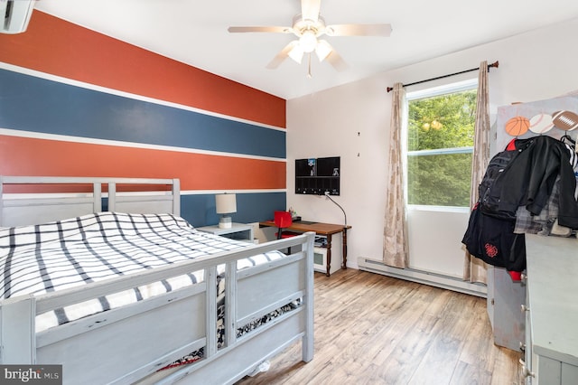 3789 Spring Rd, Carlisle, PA 17013 - bedroom with a baseboard radiator and wood finished floors