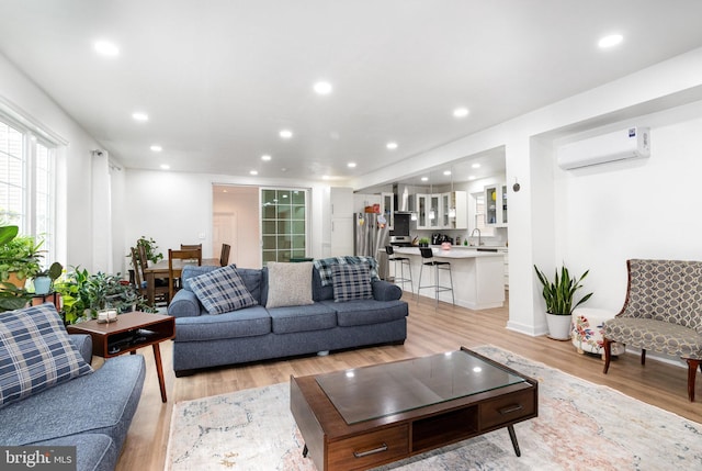 3789 Spring Rd, Carlisle, PA 17013 - living area featuring a wall unit AC, light wood-style floors, and recessed lighting