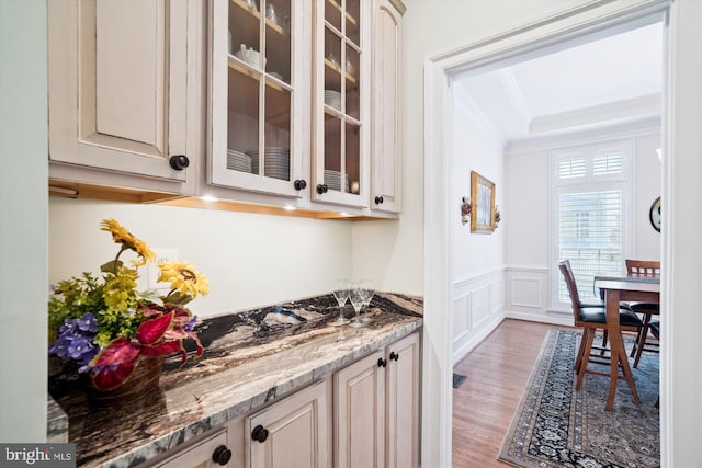 114 Lake St, Gaithersburg, MD 20878 - bar with crown molding, light wood-style flooring, wainscoting, and a decorative wall