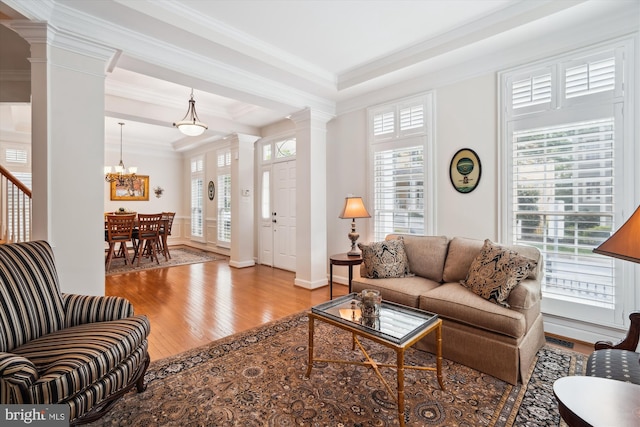 114 Lake St, Gaithersburg, MD 20878 - living area with ornate columns, ornamental molding, wood finished floors, healthy amount of natural light, and a chandelier