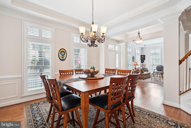 114 Lake St, Gaithersburg, MD 20878 - dining room featuring ornate columns, hardwood / wood-style floors, crown molding, a chandelier, and a tray ceiling