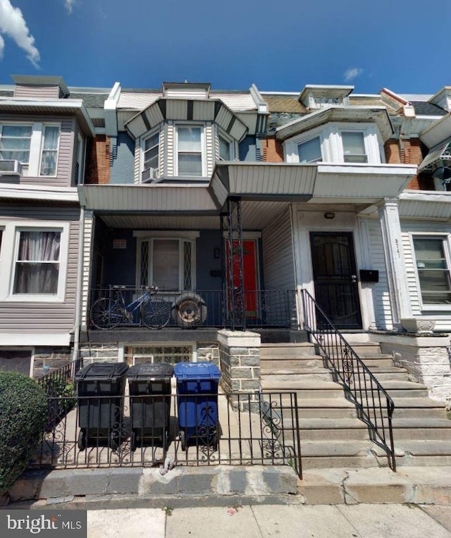 5743 Walton Ave, Philadelphia, PA 19143 - multi unit property featuring a fenced front yard and covered porch