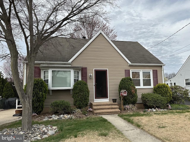 20 Dodge Dr, Hamilton, NJ 08610 - view of front of property featuring a shingled roof, a front lawn, and entry steps