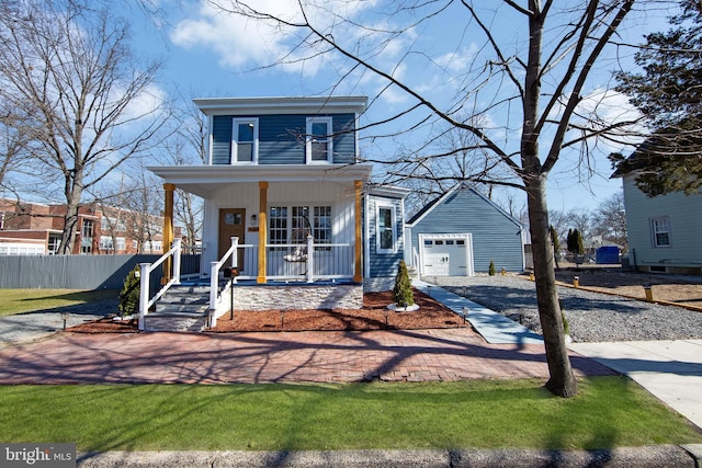 508 Vine St, Palmyra, NJ 08065 - view of front of house with covered porch, a detached garage, and gravel driveway