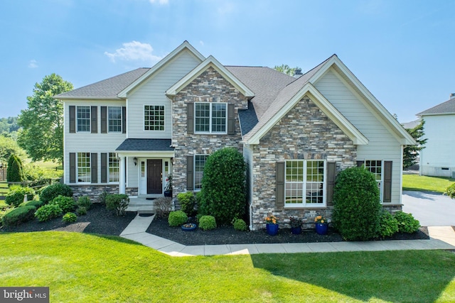 147 Palsgrove Way, Chester Springs, PA 19425 - view of front of house with stone siding and a front lawn