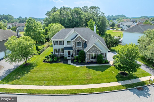 147 Palsgrove Way, Chester Springs, PA 19425 - view of front facade featuring stone siding, a front yard, a chimney, and a residential view
