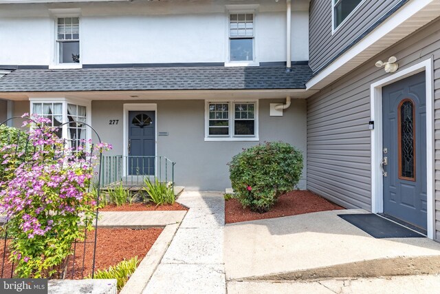 277 W Baltimore Pike, Media, PA 19063 - property entrance with a shingled roof, stucco siding, and a porch