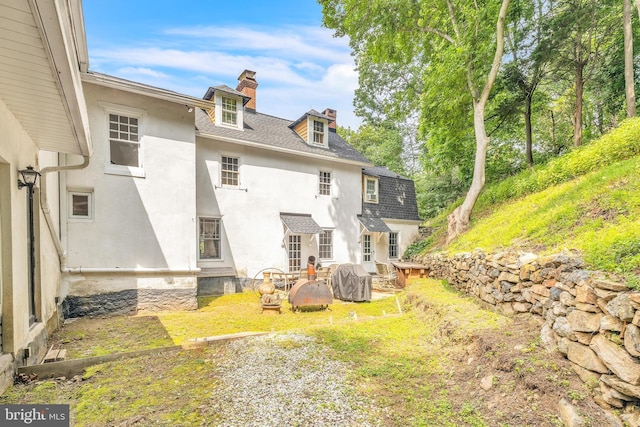 277 W Baltimore Pike, Media, PA 19063 - back of property with a chimney, stucco siding, and roof with shingles