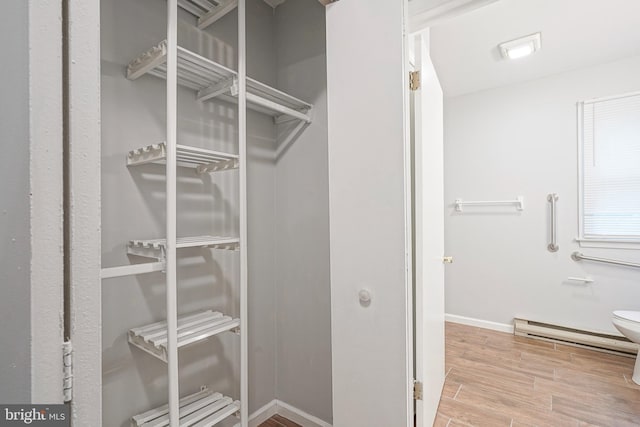 328 Spruce St, Bridgeton, NJ 08302 - spacious closet with a baseboard radiator and wood finished floors