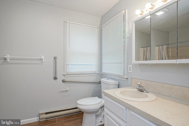 328 Spruce St, Bridgeton, NJ 08302 - full bathroom featuring a baseboard heating unit, vanity, wood finished floors, and a shower with curtain