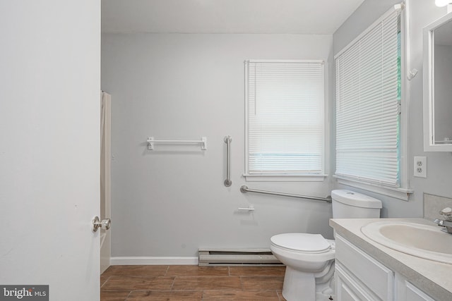 328 Spruce St, Bridgeton, NJ 08302 - bathroom featuring a baseboard heating unit, vanity, and wood finished floors