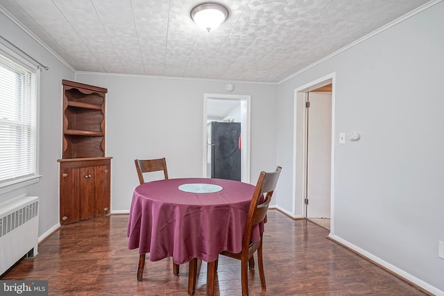 328 Spruce St, Bridgeton, NJ 08302 - dining room with radiator, wood finished floors, and crown molding