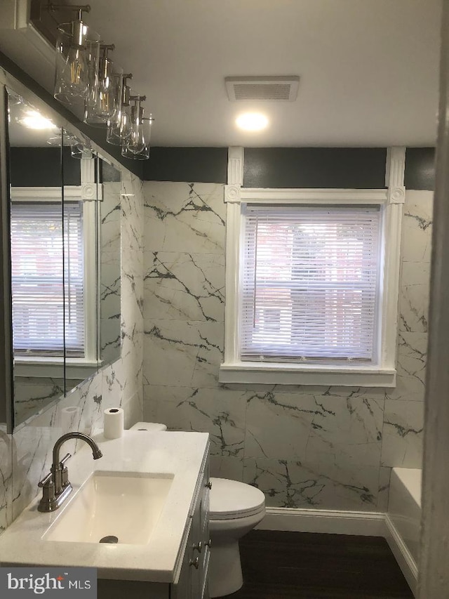 308 E 23rd St, Wilmington, DE 19802 - bathroom featuring vanity, healthy amount of natural light, a bathtub, and a shower