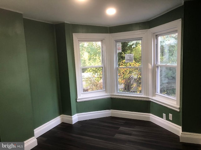 308 E 23rd St, Wilmington, DE 19802 - empty room with dark wood-style flooring, healthy amount of natural light, and crown molding