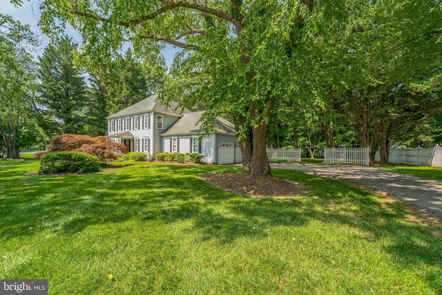 1092 Carriage Hill Pkwy, Annapolis, MD 21401 - view of yard featuring an attached garage and driveway