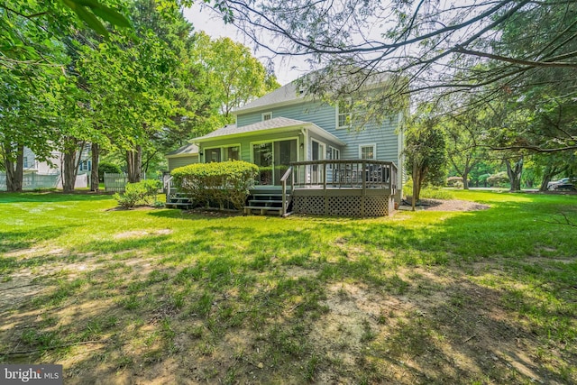 1092 Carriage Hill Pkwy, Annapolis, MD 21401 - rear view of house featuring a deck and a lawn