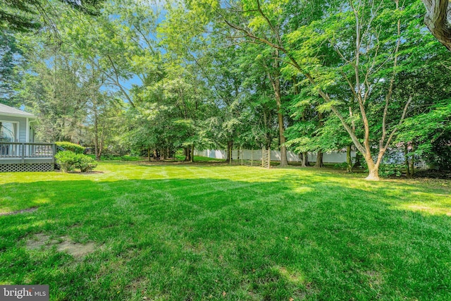 1092 Carriage Hill Pkwy, Annapolis, MD 21401 - view of grassy yard with a deck