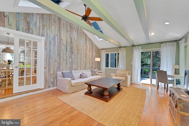 1092 Carriage Hill Pkwy, Annapolis, MD 21401 - living area with wood finished floors, a skylight, ceiling fan, recessed lighting, and wooden walls