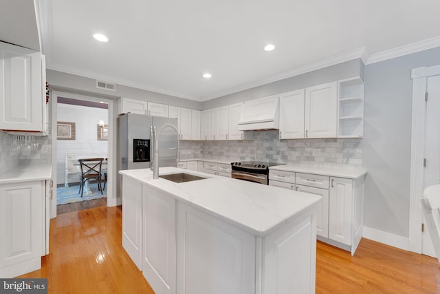 1092 Carriage Hill Pkwy, Annapolis, MD 21401 - kitchen featuring custom range hood, appliances with stainless steel finishes, white cabinets, a kitchen island with sink, and crown molding
