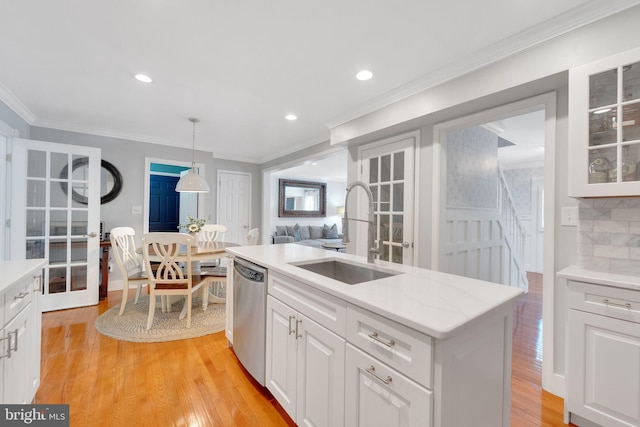 1092 Carriage Hill Pkwy, Annapolis, MD 21401 - kitchen featuring stainless steel dishwasher, light wood finished floors, white cabinets, glass insert cabinets, and crown molding