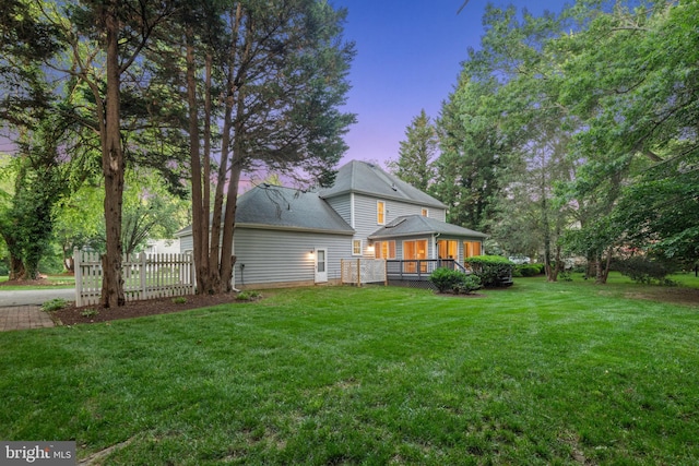 1092 Carriage Hill Pkwy, Annapolis, MD 21401 - back of house at dusk featuring a deck