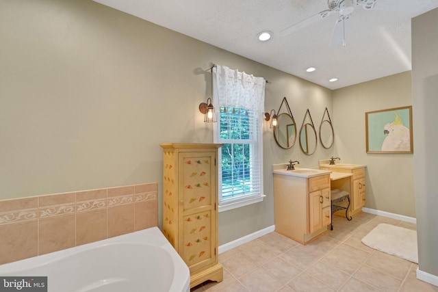 1092 Carriage Hill Pkwy, Annapolis, MD 21401 - full bathroom with vanity, tile patterned flooring, a garden tub, a ceiling fan, and recessed lighting